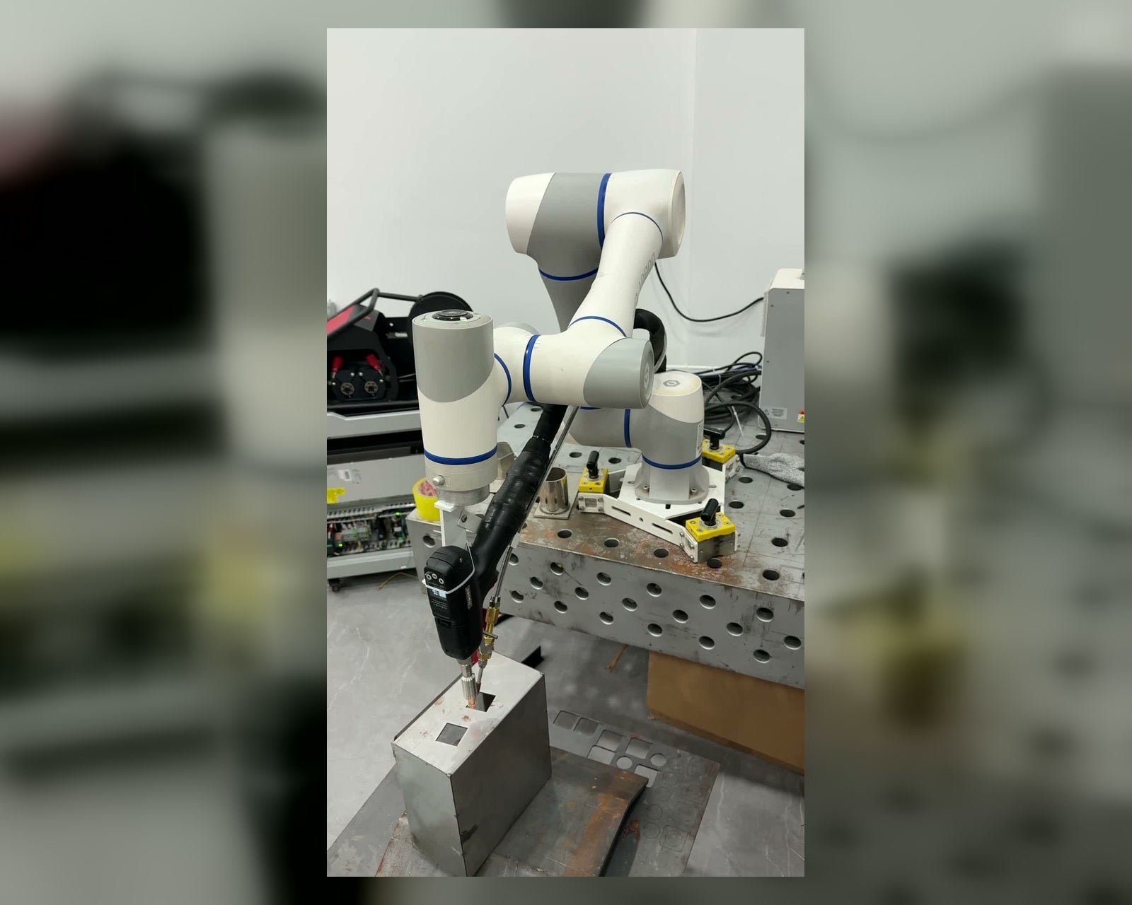 WeldAir handheld laser welder mounted on a collaborative robot for DIY robotic welding