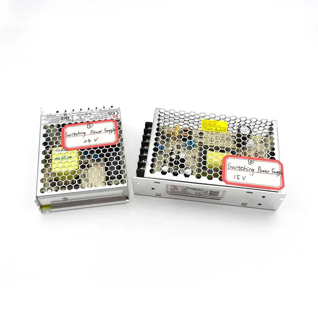 Two switching power supplies with metal mesh covers and labels indicating 24V and 12V on a white background.
