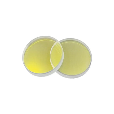 Two round yellow laser cutting lenses for high-value cutting applications.